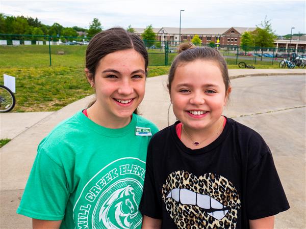 Students bike to school in the morning.